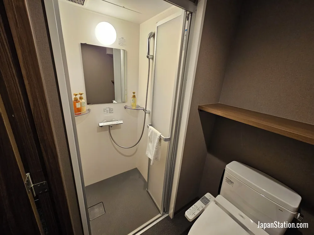 Bathroom in a guest room at Dormy Inn Kobe Motomachi.