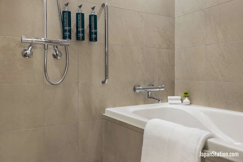 Bathroom in a guest room at DoubleTree by Hilton Toyama.