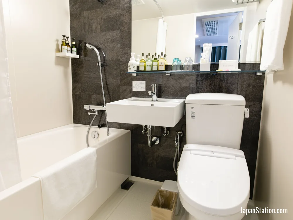 Bathroom in a guest room at KOKO HOTEL Ikebukuro.